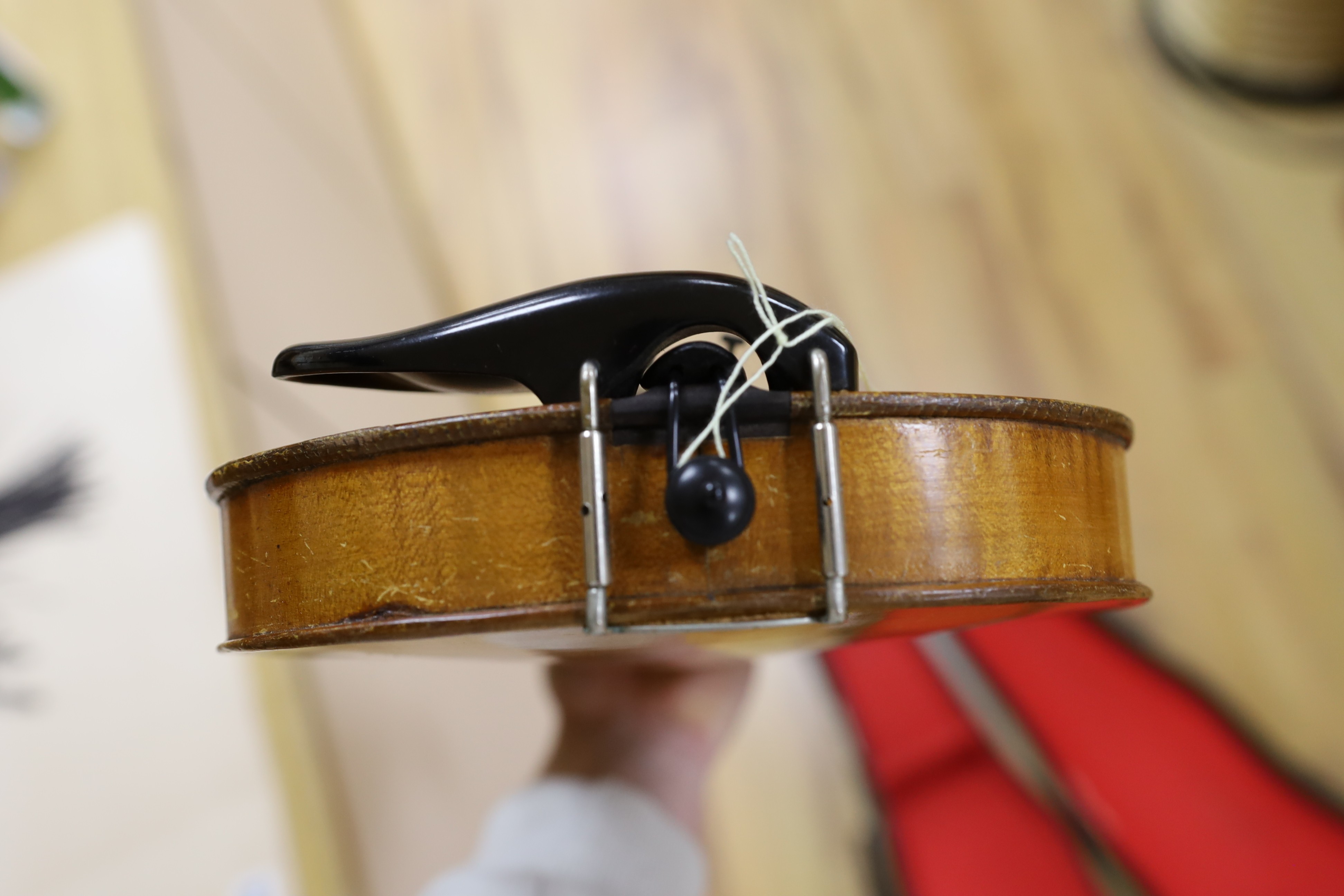 A cased student's violin, length of back 33 cm